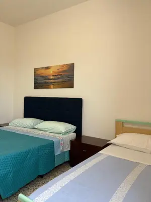 Letto o letti in una camera di Affittacamere Belvedere - Posada