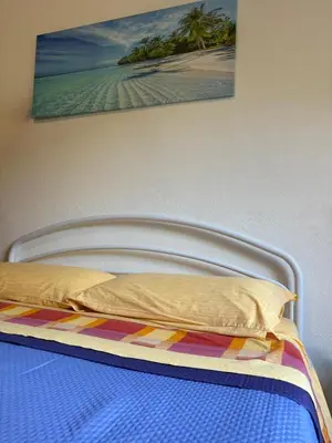 Letto o letti in una camera di Affittacamere Belvedere - Posada
