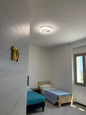 Letto o letti in una camera di Affittacamere Belvedere - Posada
