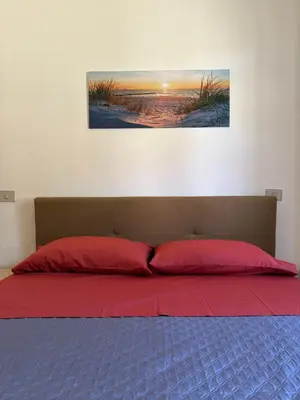 Letto o letti in una camera di Affittacamere Belvedere - Posada