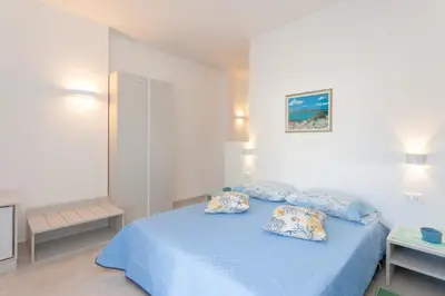 Letto o letti in una camera di Domo Davide