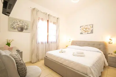 Letto o letti in una camera di Capo Comino 3