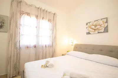 Letto o letti in una camera di Capo Comino 3