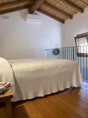 Letto o letti in una camera di Zenia C