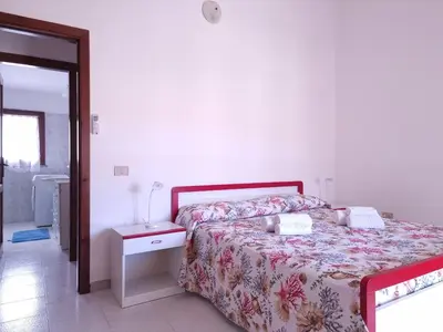Letto o letti in una camera di Residenze Piras - Budoni Sweet Home