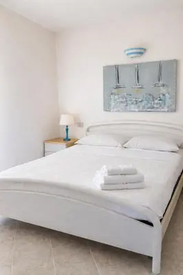 Letto o letti in una camera di Residenze Piras - Budoni Sweet Home