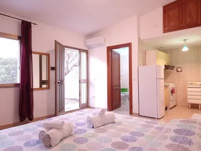 Letto o letti in una camera di Residenze Solemar