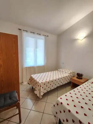 Letto o letti in una camera di Il Nido 2 di San Pietro