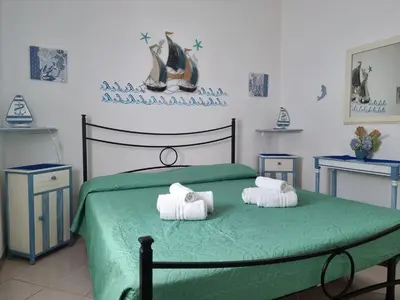 Letto o letti in una camera di Residenze Lu Rinaggiu