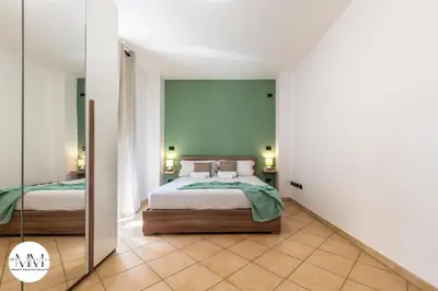 Letto o letti in una camera di MMHS-Olbia Centro