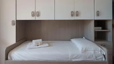 Letto o letti in una camera di La casa di Leo e Lucy
