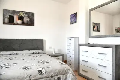 Letto o letti in una camera di Perla Apartment con vista mare