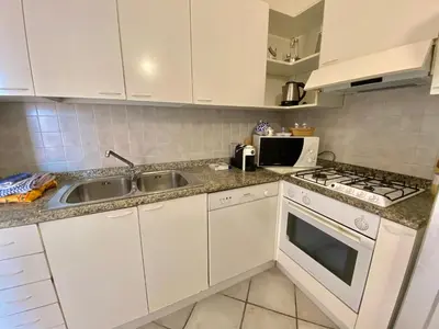 Cucina o angolo cottura di Luxury apartment Elicriso sea view with common swimming pool just 100 mt from the beach
