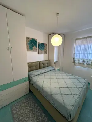 Letto o letti in una camera di Casa Arianna