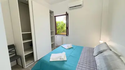 Letto o letti in una camera di Blu Caletta - waterfront apartment with garden
