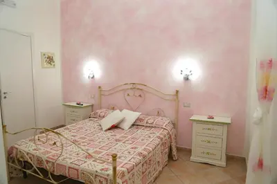 Letto o letti in una camera di B&B Le Rose