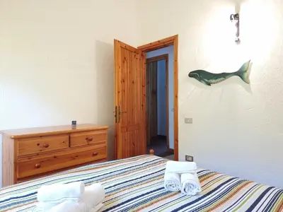 Letto o letti in una camera di Residenza Bella Vista - Budoni Sweet Home