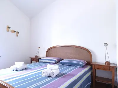 Letto o letti in una camera di Residenza Bella Vista - Budoni Sweet Home
