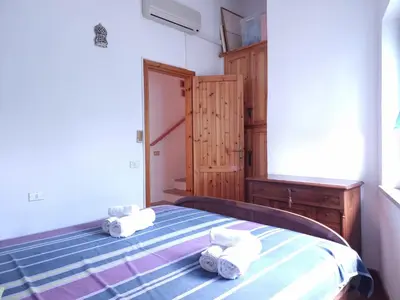 Letto o letti in una camera di Residenza Bella Vista - Budoni Sweet Home