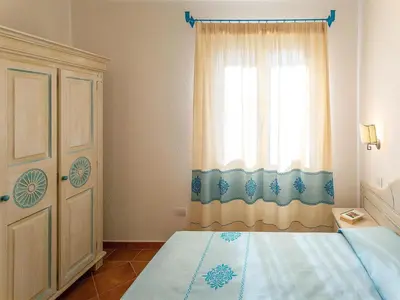 Letto o letti in una camera di Apartment in Orosei near Marina di Orosei Beach