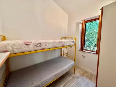 Letto o letti in una camera di Appartamento a 650 mt dal mare - San Teodoro