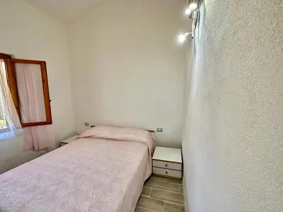 Letto o letti in una camera di Appartamento a 650 mt dal mare - San Teodoro