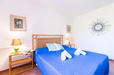 Letto o letti in una camera di Green Oasis - 2 Min Walk from Cala Girgolu