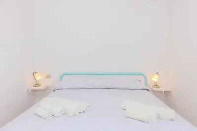 Letto o letti in una camera di Villa Due Mari Coda Cavallo