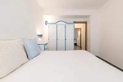 Letto o letti in una camera di NG Collection Luna di Mare