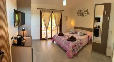 Letto o letti in una camera di Villaggio La Cinta