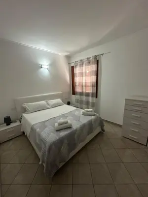 Letto o letti in una camera di SUNRISE SARDINIA Olbia