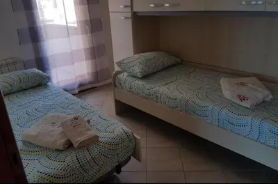 Letto o letti in una camera di SUNRISE SARDINIA Olbia
