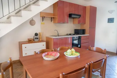 Cucina o angolo cottura di Giodi Appartamenti La Cinta 3