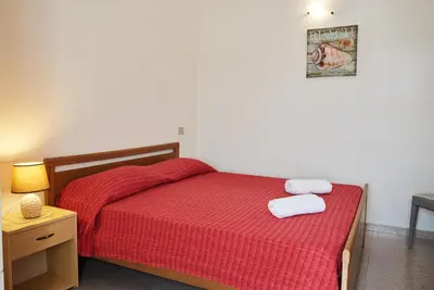 Letto o letti in una camera di La Casa delle Sirene - Appartamenti in villetta