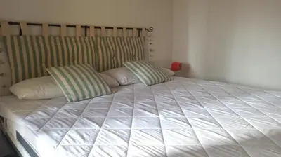 Letto o letti in una camera di Casa Maggy
