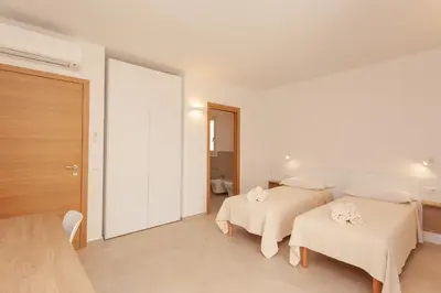 Letto o letti in una camera di Lu Sulianu