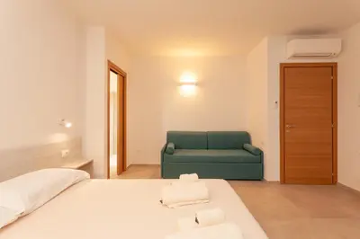 Letto o letti in una camera di Lu Sulianu