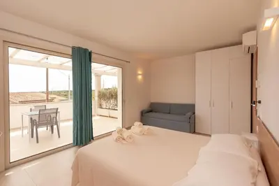 Letto o letti in una camera di Lu Sulianu