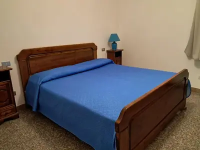 Letto o letti in una camera di fmp-ps01 villa 300 metri mare 4 letto