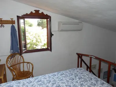 Letto o letti in una camera di Monolocale San Teodoro