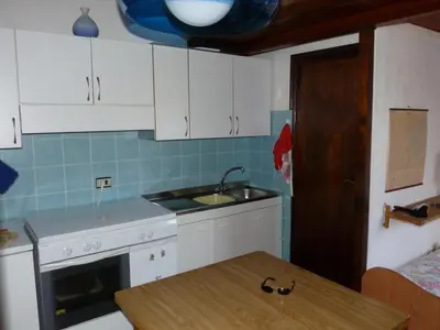 Cucina o angolo cottura di Monolocale San Teodoro