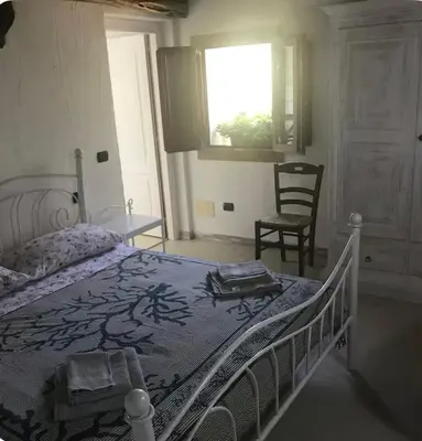 Letto o letti in una camera di Stanza Isuledda