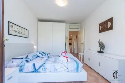 Letto o letti in una camera di Il Borgo 20 D4 700m From The Beach - Happy Rentals