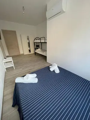 Letto o letti in una camera di B&B Domo Mia