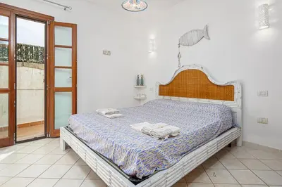 Letto o letti in una camera di Appartamento in Villetta a 800 mt dalla spiaggia