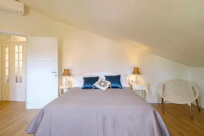 Letto o letti in una camera di Roof33 Attico di Lusso in centro a Olbia