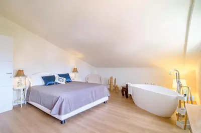 Letto o letti in una camera di Roof33 Attico di Lusso in centro a Olbia