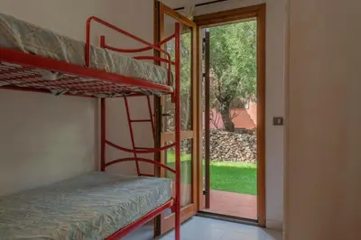 Letto o letti in una camera di Outstanding Residenze Gallura 2Bedrm sleep 6 plus possible additional Child bed