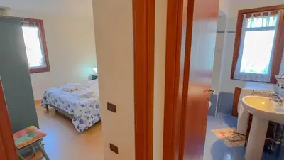 Letto o letti in una camera di Casa Tombolini