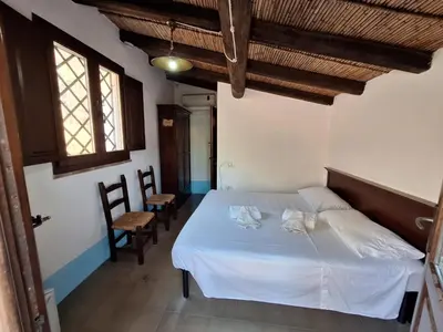 Letto o letti in una camera di Malicas